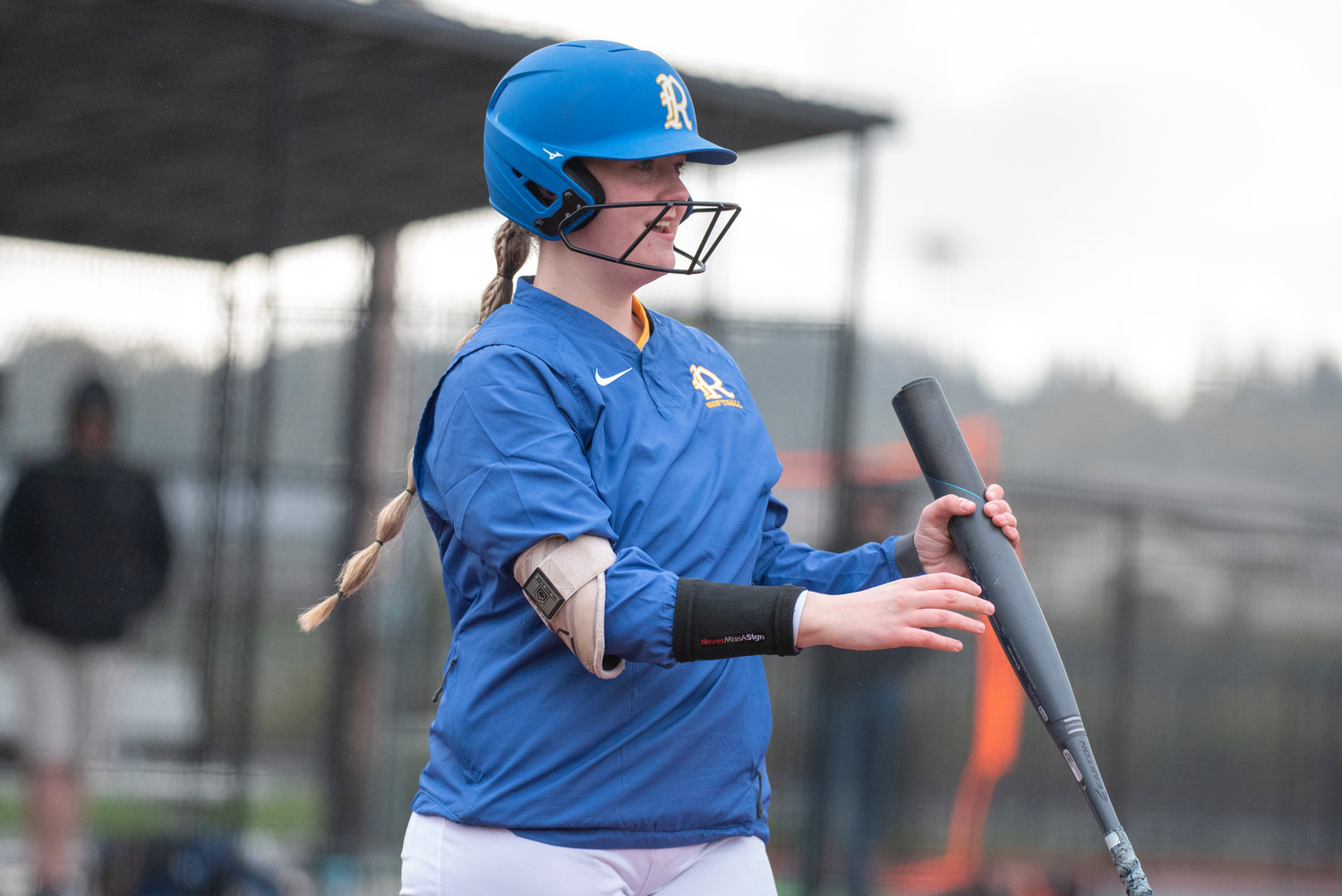 Rochester senior Lakota Escott smiles during an at-bat against W.F. West at Chehalis Sports Complex on April 13.