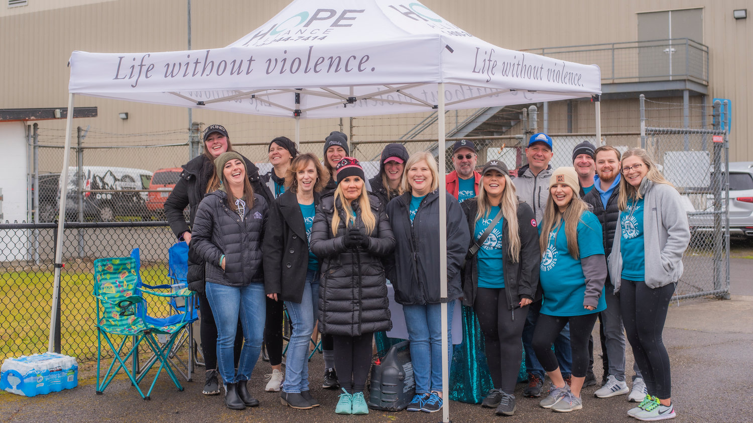 Attendees of a Hope Alliance "Walk A Mile In Their Shoes" event pose for a photo at Tiger Stadium in Centralia last April.