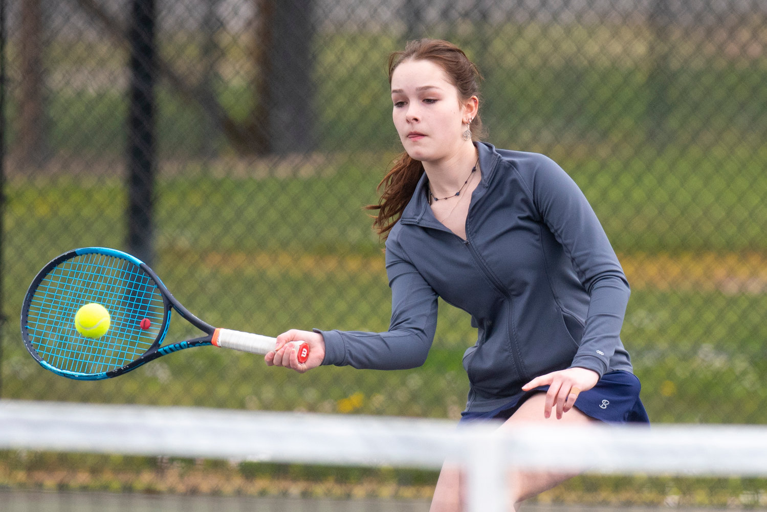 Black Hills Athena Moore returns a Centralia serve during the No. 1 doubles match on the road on April 19.