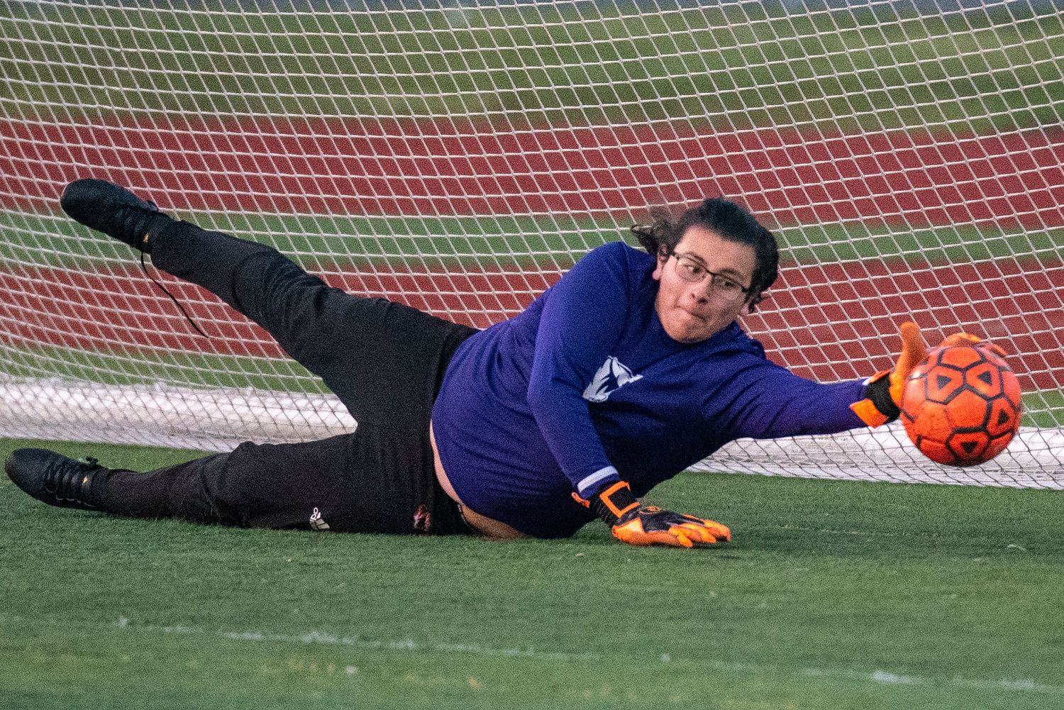 Centralia keeper Victory Reyes dives to make a save in regulation against W.F. West on April 22.