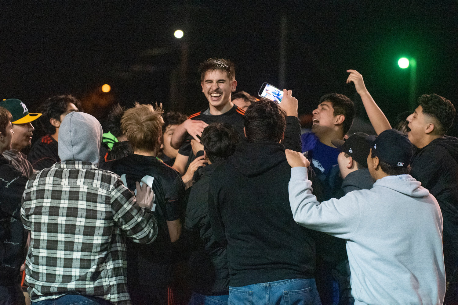 Centralia's Darrell Neuert gets mobbed by teammates and students after hitting the Chronicle Cup-winning PK against W.F. West on April 22.