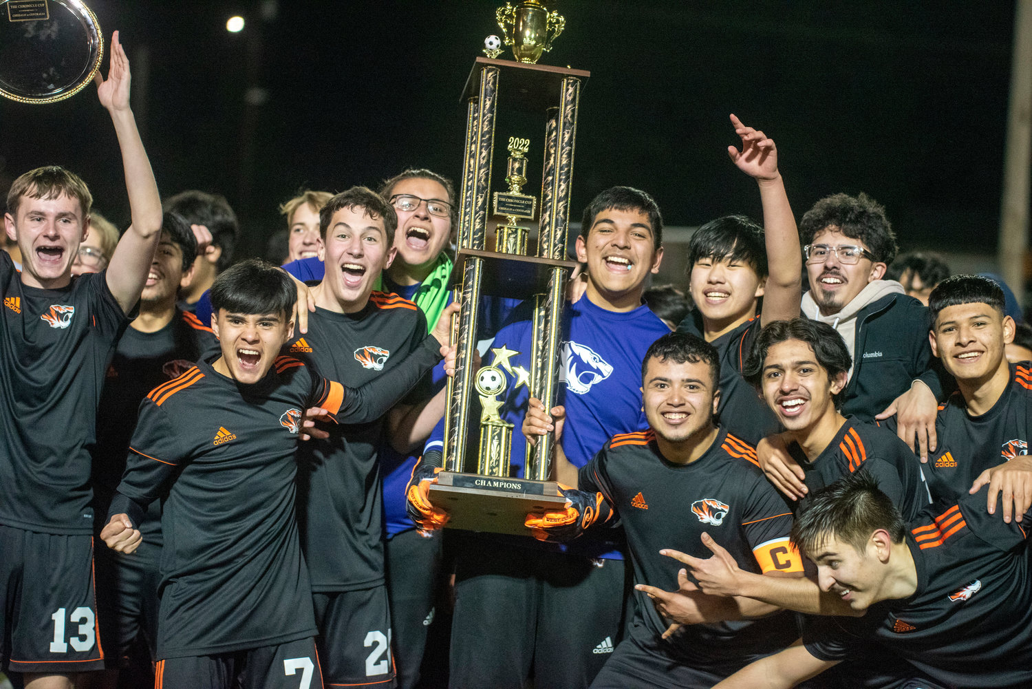 Centralia soccer players hoist The Chronicle Cup trophy after defeating W.F. West in PKs twice on Friday at Tiger Stadium.