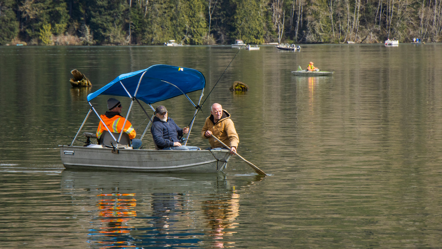 Participants in the Mineral Lake Fishing Derby look on from a boat Saturday morning.