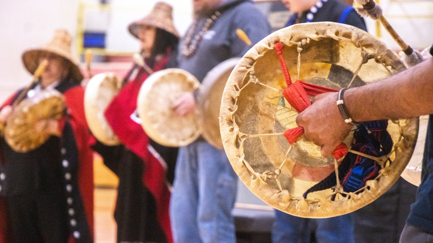 Drums are played by members of the Cowlitz Tribe during a ceremony at Toledo High School inside George Murdock Gymnasium on Friday.