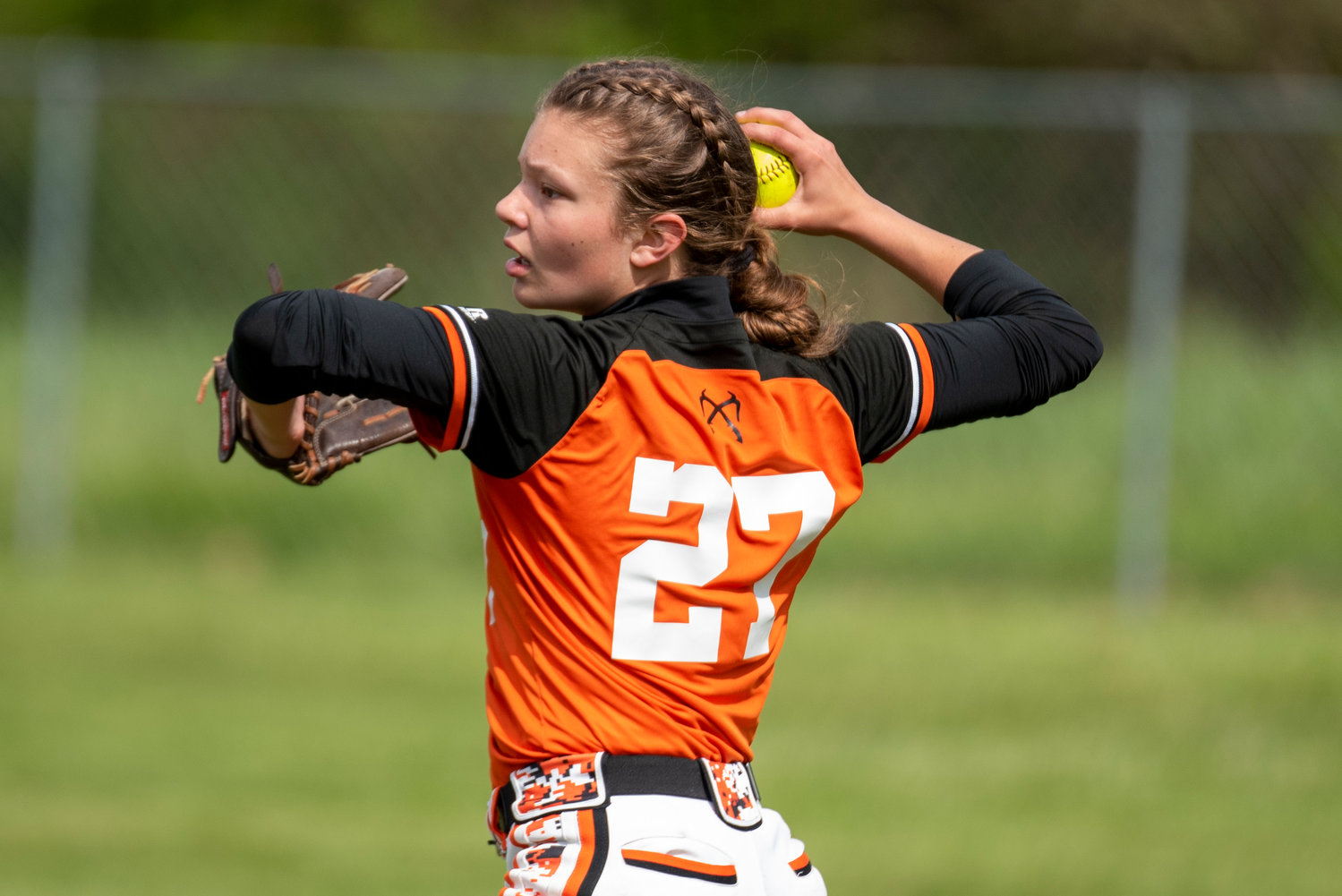 Rainier's Raychel Hansen makes a throw to the infield from right field during a road game in Toledo on April 25.
