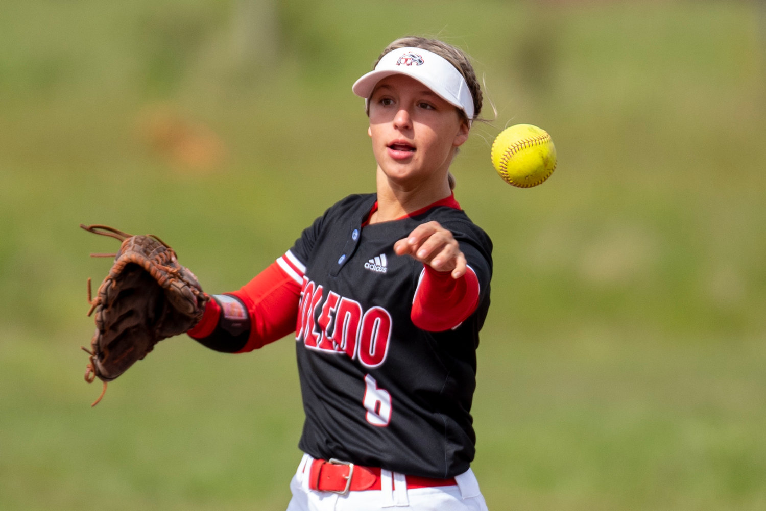 Toledo shortstop Brynn Williams makes a throw to first base during a home game against Rainier on April 25..
