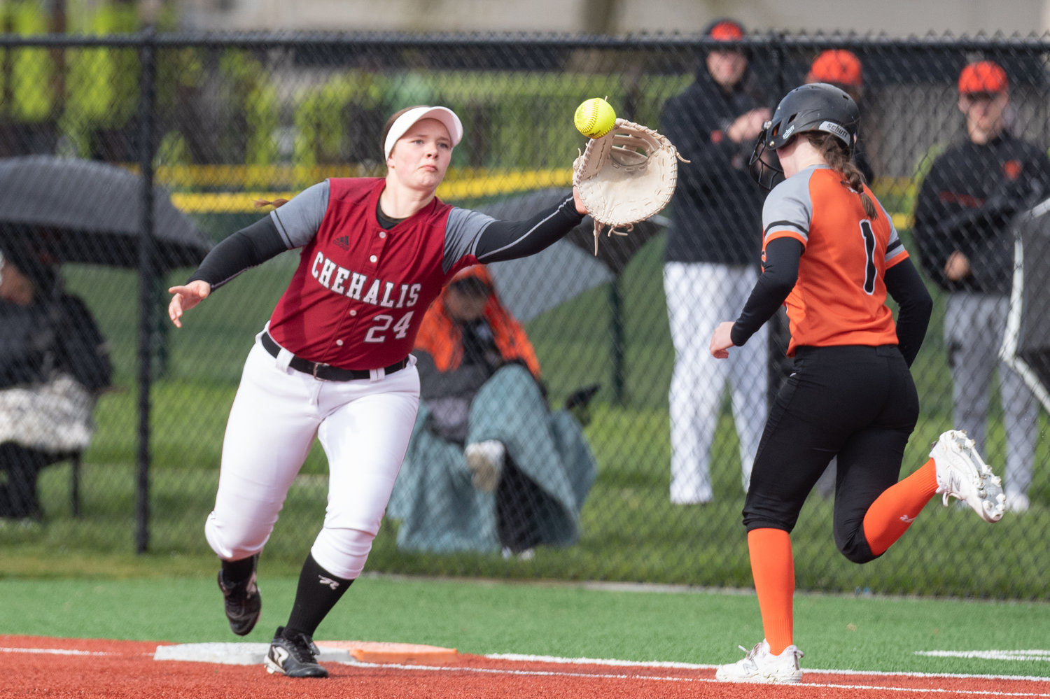 W.F. West's Savannah Hawkins stretches off the base to haul in an errant throw against Centralia April 26 at Recreation Park.