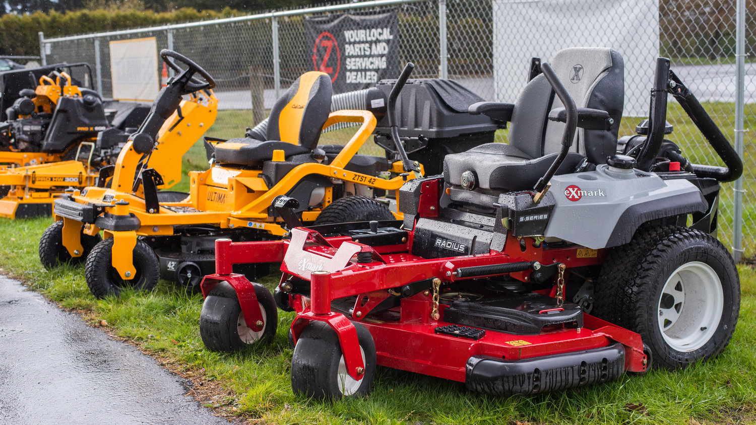 Riding lawn mowers sit on display outside the Power Shop in Centralia on Thursday.