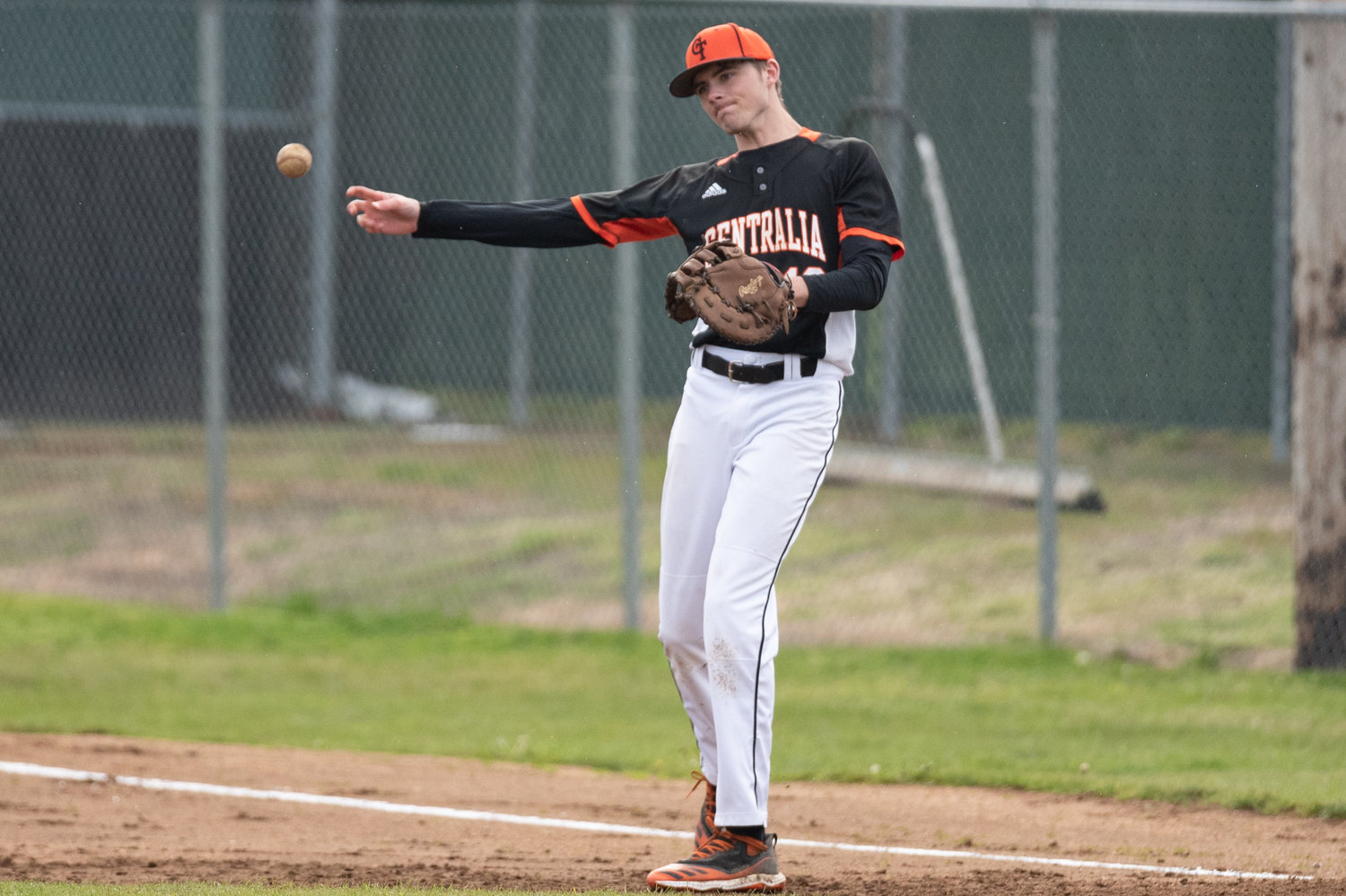 Centralia first baseman Landon Kaut looks to throw during warmups against W.F. West April 28.