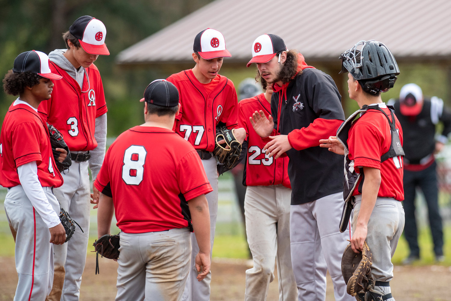 Oakville coach Connor Bensen talks to his team during a home game against Mossyrock at Legends Field Complex on April 28.