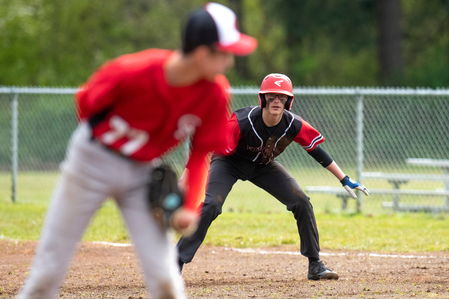 Mossyrock's Hunter Isom leads off first base during a road game against Oakville at Legends Field Complex on April 28.