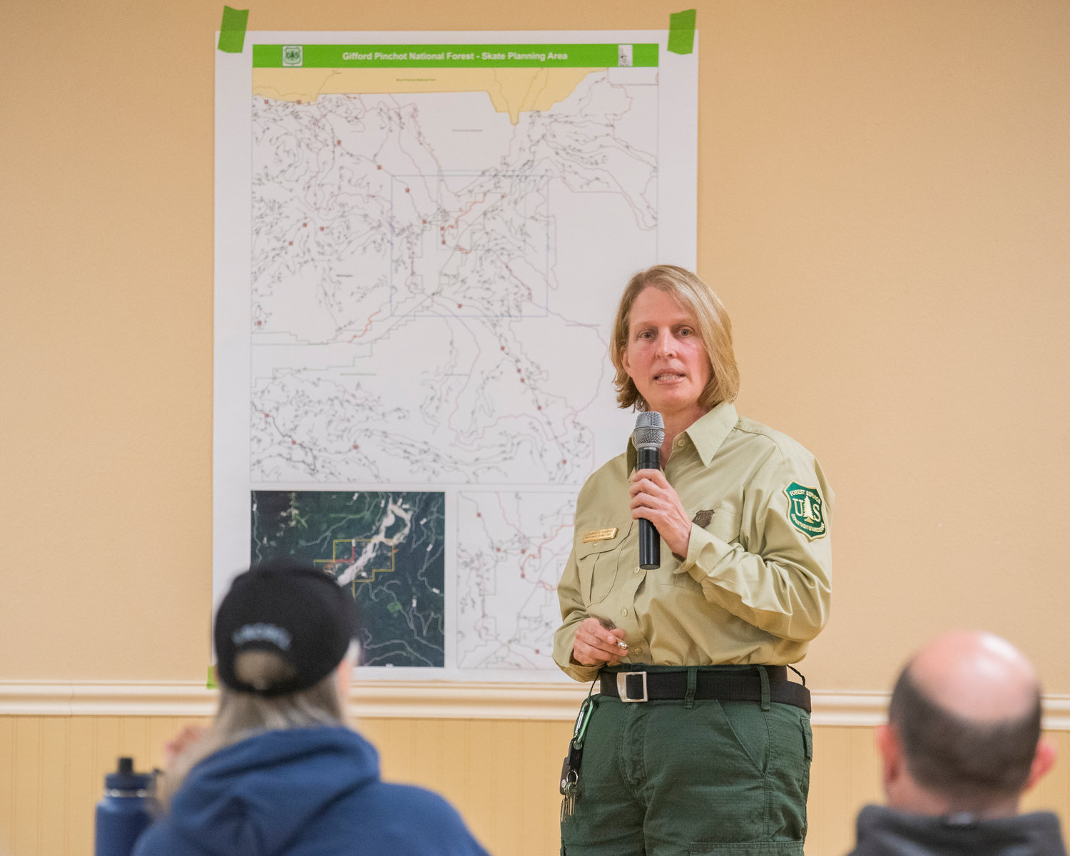 Zone Fire Management Officer Jennifer Harris, talks about the Cowlitz Valley Ranger District while pointing out areas on a map of the Gifford Pinchot National Forest State Planning Area Thursday night at the Packwood Community Center.