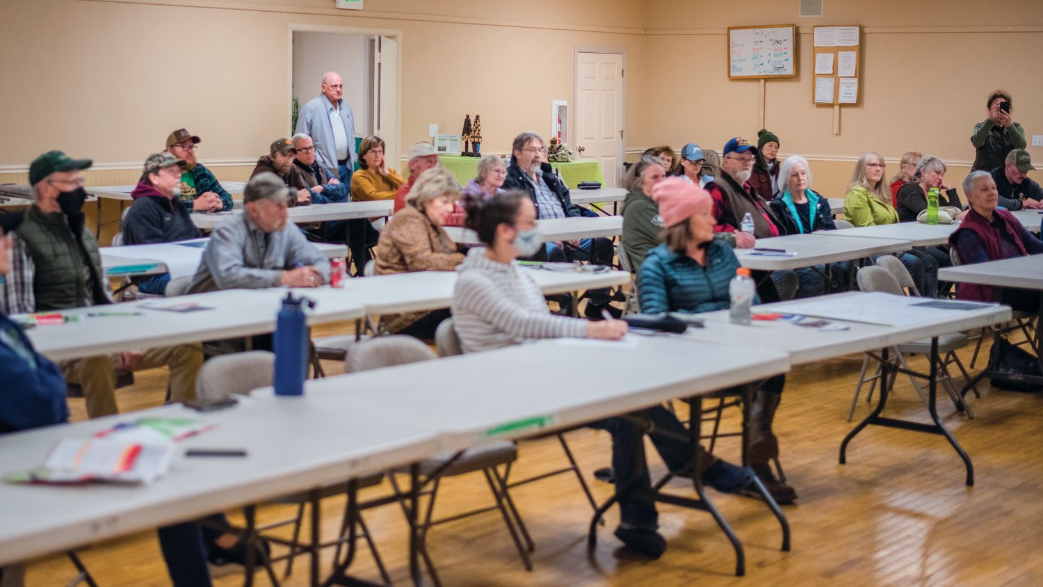 Attendees listen to speakers talk about the Community Fire Wise program Thursday night at the Packwood Community Center.