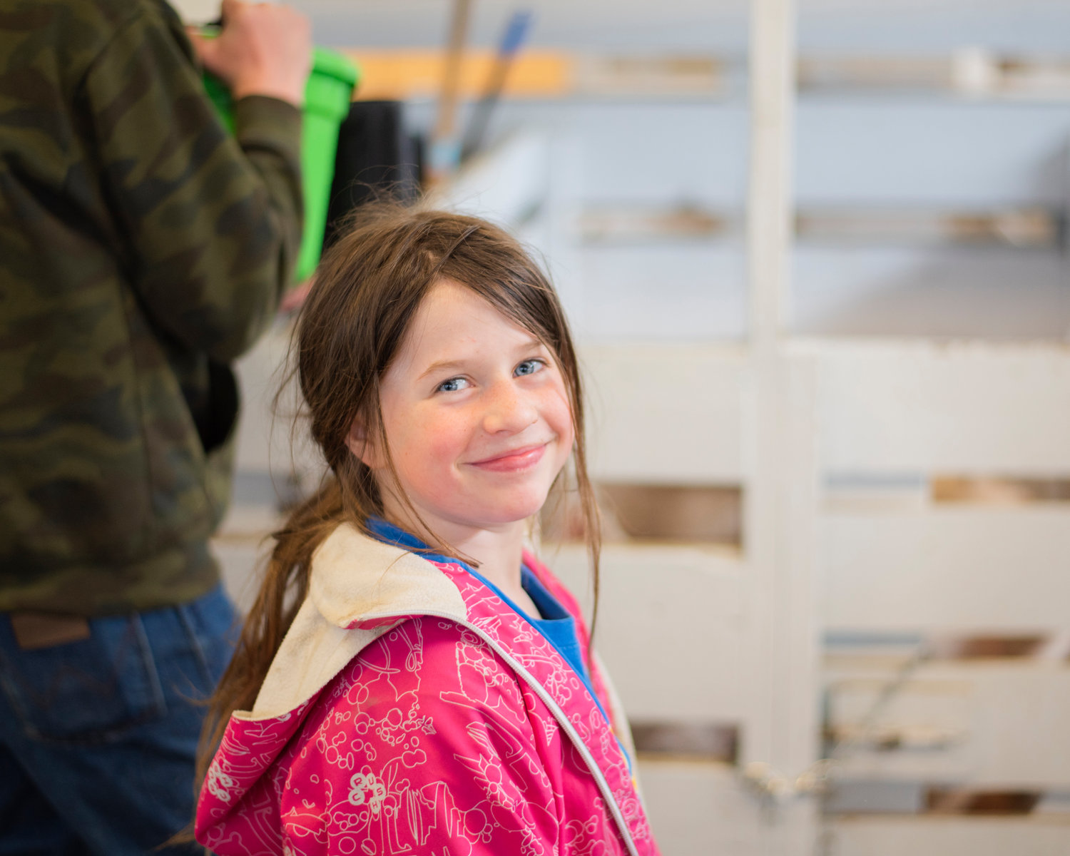 Helen Knabel, 8, smiles while talking about her pig Strawberry at the Southwest Washington Fairgrounds during the Spring Youth Fair on Friday in Centralia.