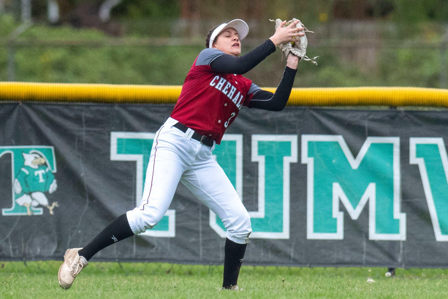 W.F. West left fielder Chase White makes a catch against Tumwater during a road game on May 2.