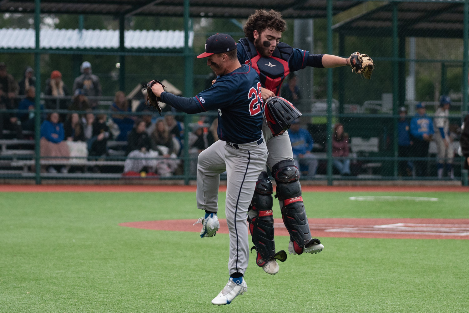 Black Hills catcher Parker Termini and pitcher Brayden Golder celebrate a double play against Rochester in a play-in game at the Regional Athletic Complex in Lacey May 6.