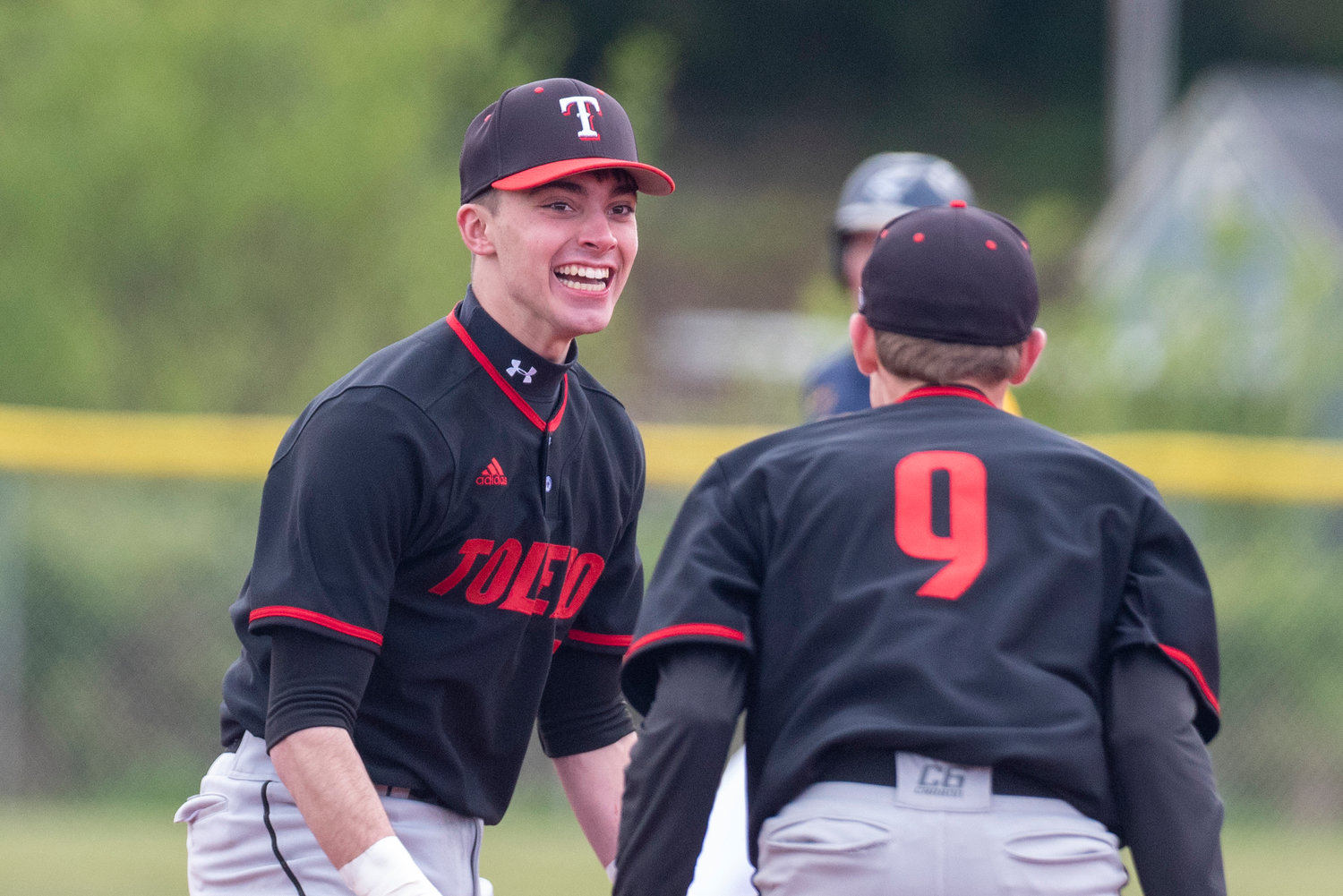 Toledo's Carson Gould, left, and Rogan Stanley (9) celebrate after defeating Ilwaco in a district playoff game on May 7.