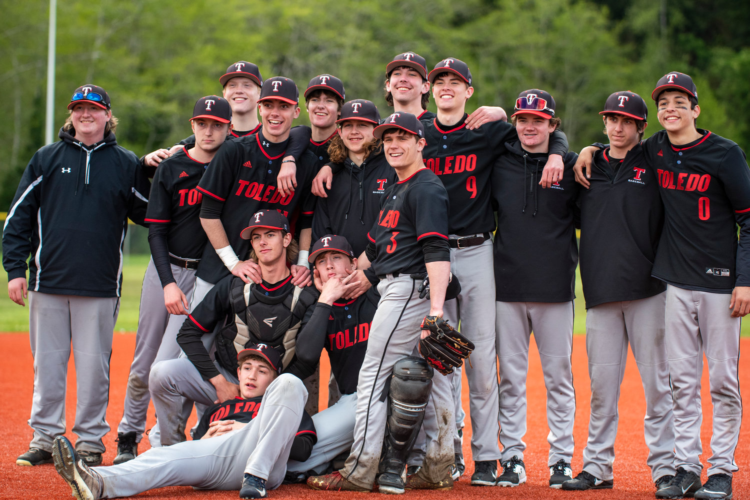 Toledo baseball players pose for a photo after defeating Wahkiakum and Ilwaco in the district playoffs on Saturday to advance to the semifinal round.