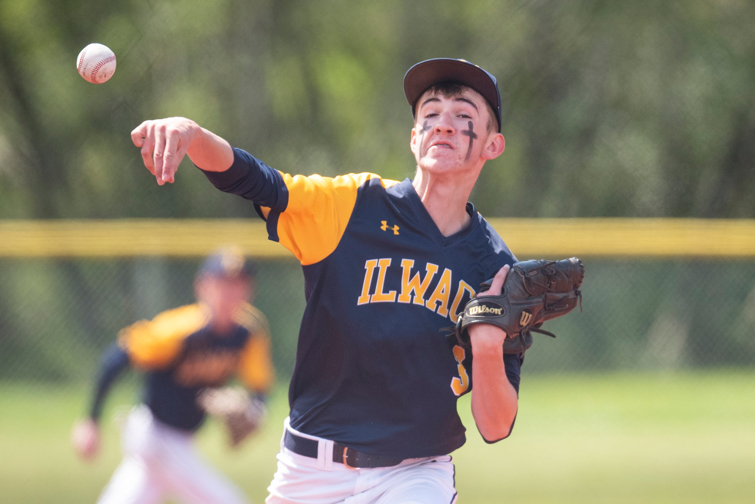 Ilwaco pitcher Jacob Rogers delivers a pitch to a Toledo batter.