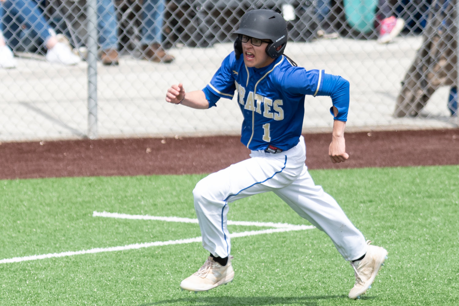 Adna's Tristan Percival sprints home to beat a throw against Forks in the District 4 quarterfinals at Shelton High School May 7.