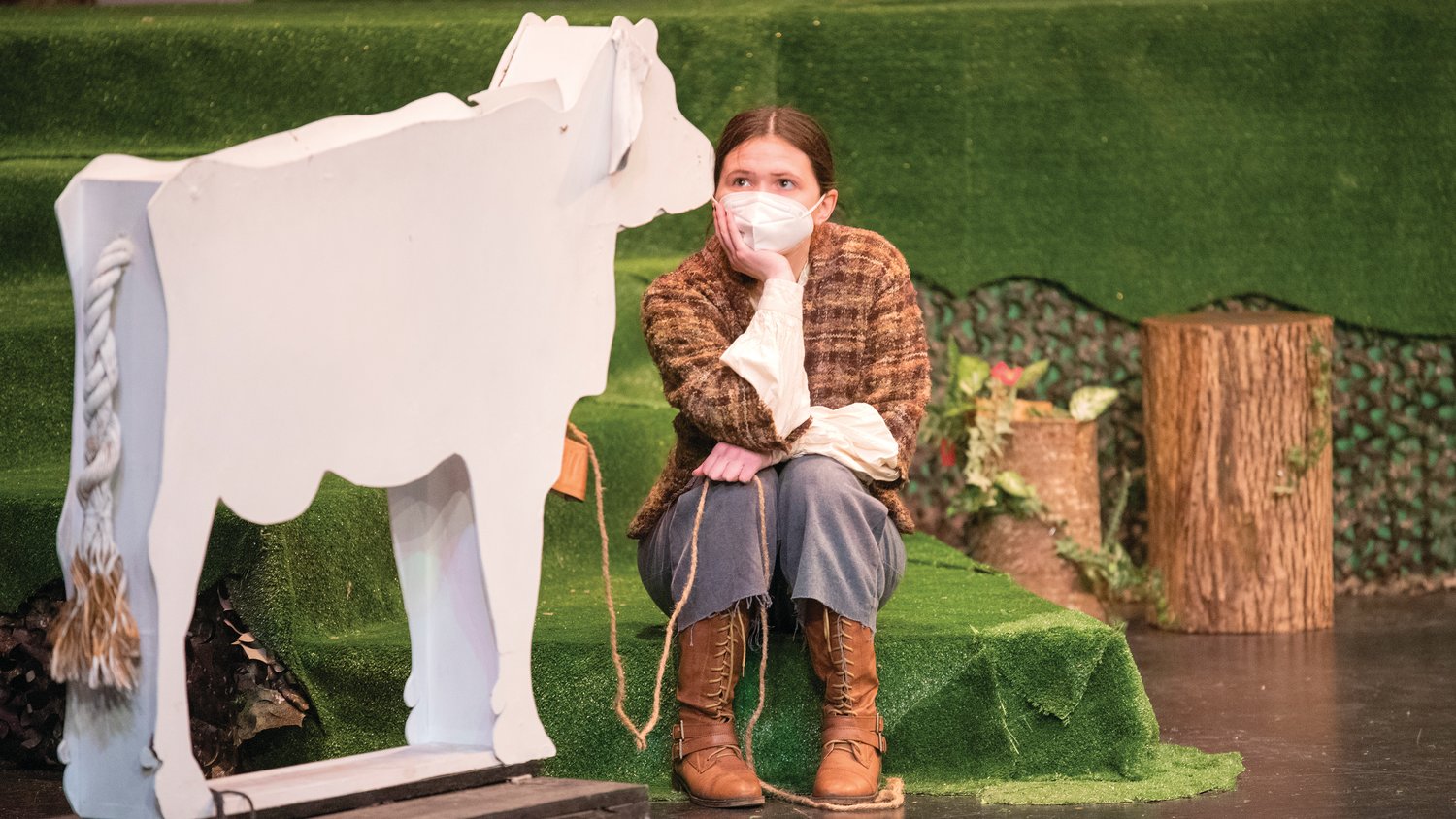 Lenora Page looks to a cow-shaped prop while playing Jack during dress rehearsals for “Into The Woods” at Centralia College Thursday afternoon.