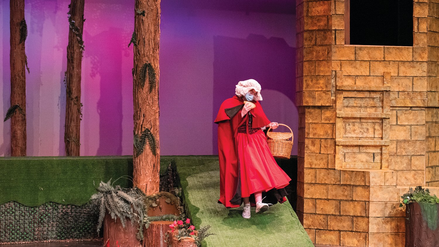 Emily Cole skips across the stage while playing Little Red Riding Hood during dress rehearsals for “Into The Woods,” directed by Emmy Kreilkamp at Centralia College.
