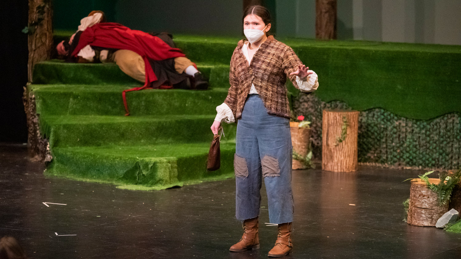 Lenora Page holds a sack of beans on stage while playing Jack during dress rehearsals for “Into The Woods,” presented by the Centralia College Theatre program.
