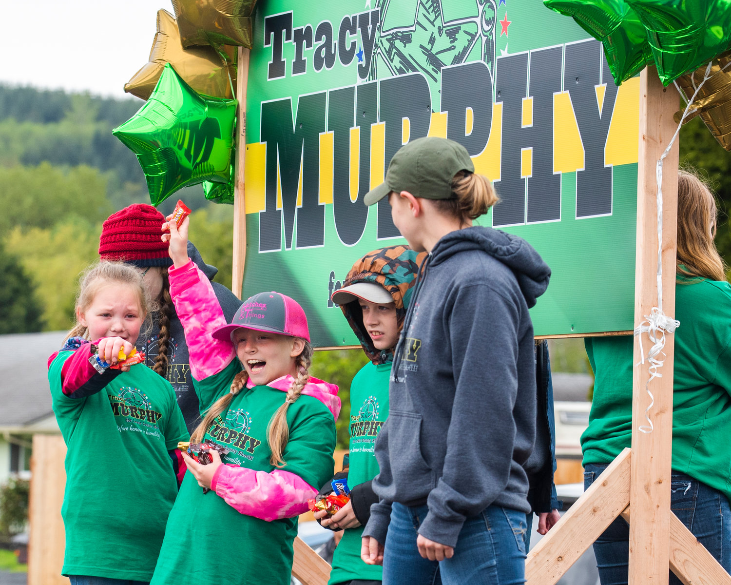 Kids throw candy from a “Tracy Murphy,” float during the Vader May Day Parade Saturday morning.