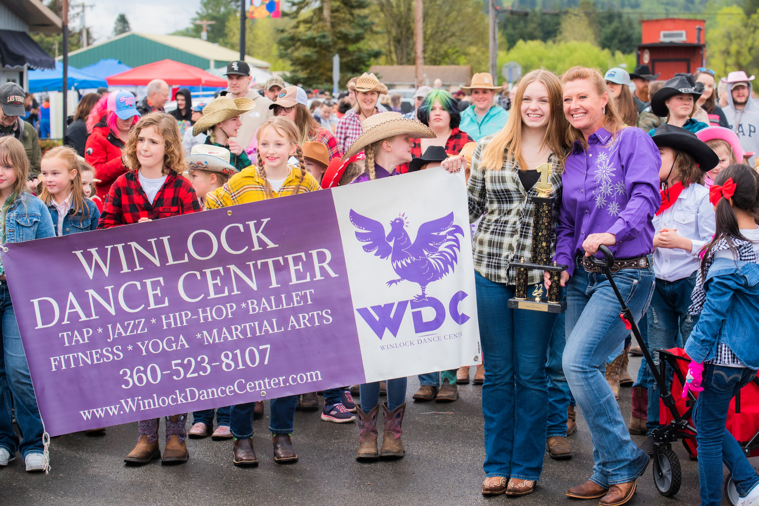 The Winlock Dance Center receives the first place trophy during the Vader May Day Parade Saturday morning.