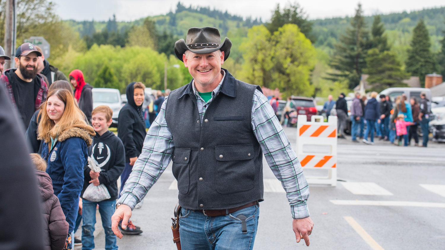 Tracy Murphy smiles while greeting attendees of the Vader May Day Parade Saturday morning.