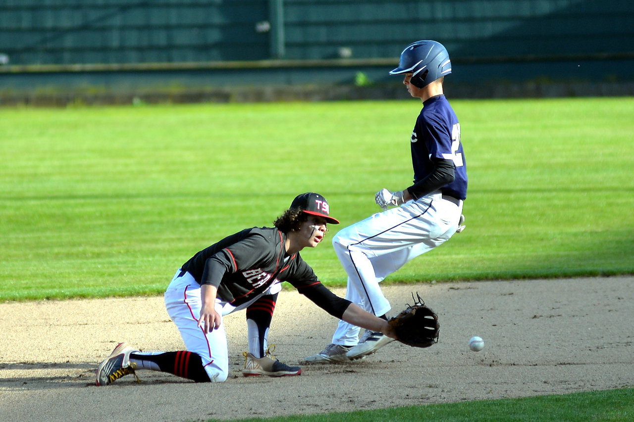 Tenino infielder Brody Noonan covers second base as Seton Catholic's Ryker Ruelas runs in safely during a 1A District 4 playoff game on Monday in Hoquiam.