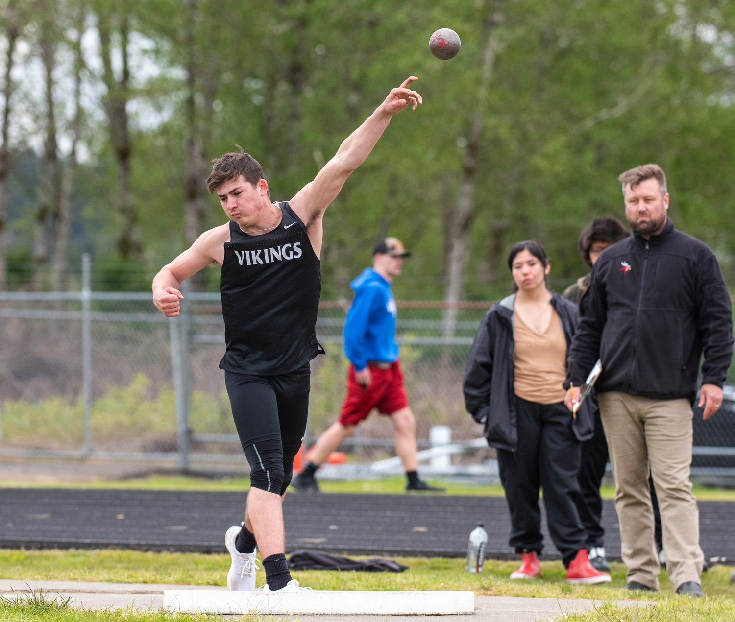 Mossyrock's Matteo Mendoza launches the shot put during districts on May 11 in Raymond.