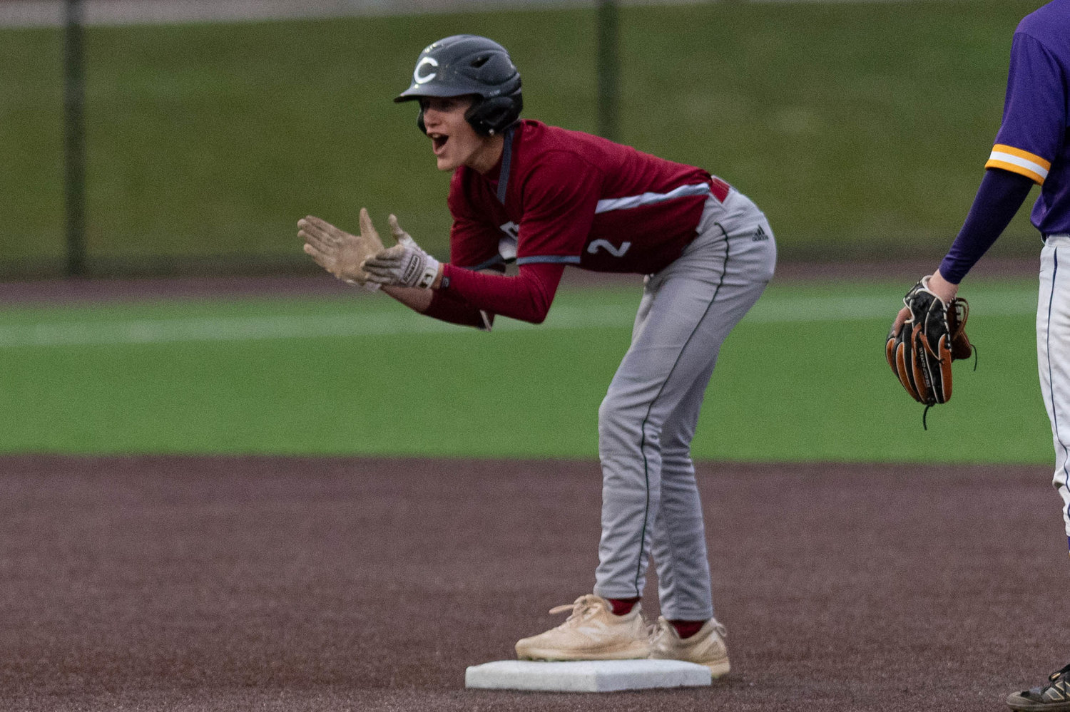 W.F. West's Braden Jones claps after his double scored two runs against Columbia River in the 2A District 4 semifinals May 11 at Ridgefield.