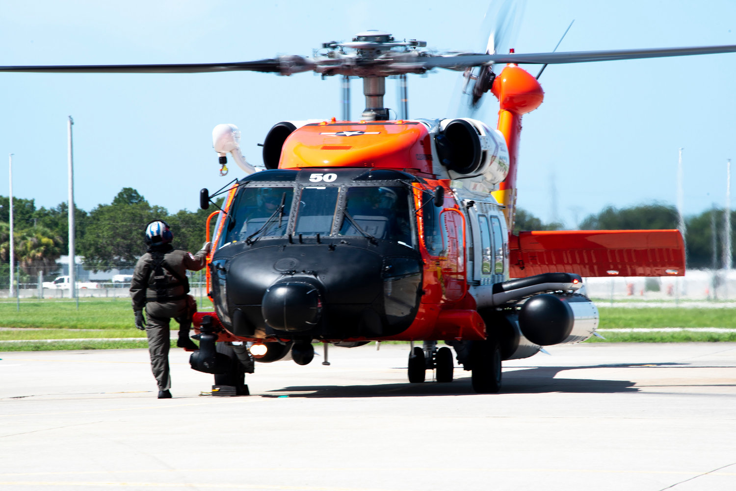 A Coast Guard H-60 Jayhawk helicopter crew arrives at Coast Guard Air Station Clearwater, Florida, July 13, 2021. (Petty Officer 1st Class Lisa Ferdinando/U.S. Coast Guard/TNS)