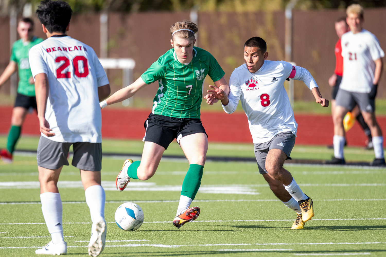 Tumwater's Myles Leneker (7) and W.F. West's Elvis Leal Perez (8) battle for possession during the 2A District IV semifinals in Tumwater on May 12.