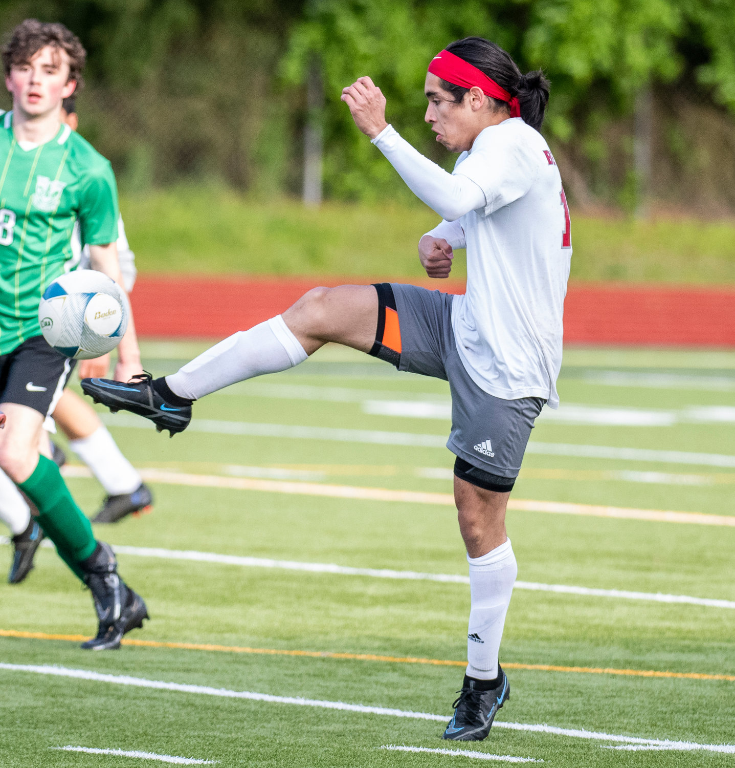 W.F. West's Isaac Madrigal clears a ball during the district semifinals against Tumwater on May 12.