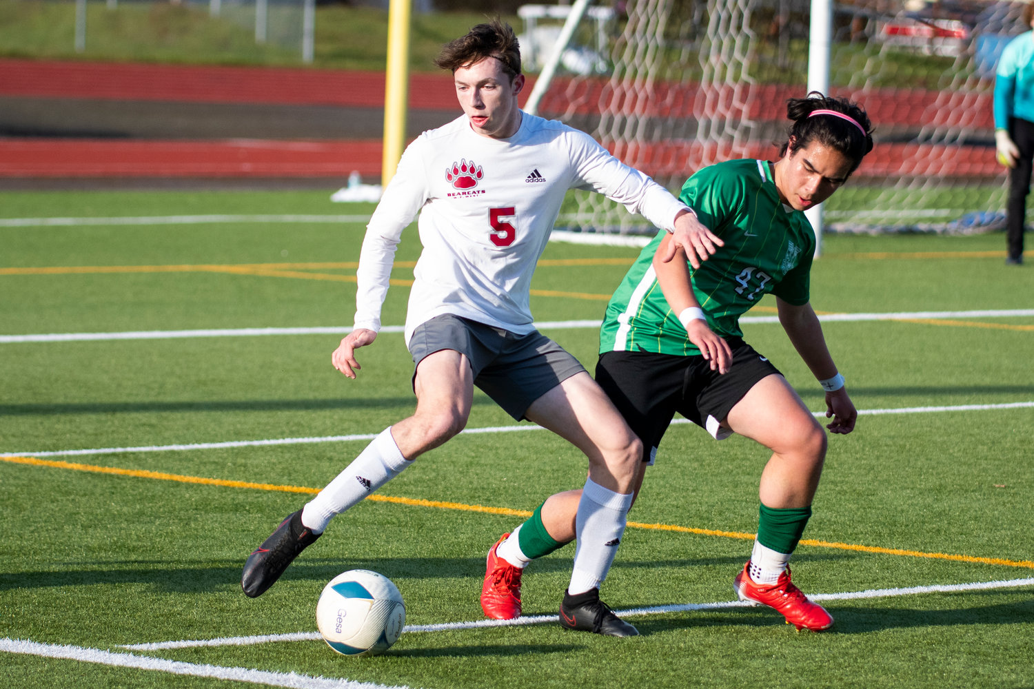 W.F. West's Cody Pennington (5) battles for the ball against Tumwater's Keegan Trubia (47) during the district semifinals on May 12.