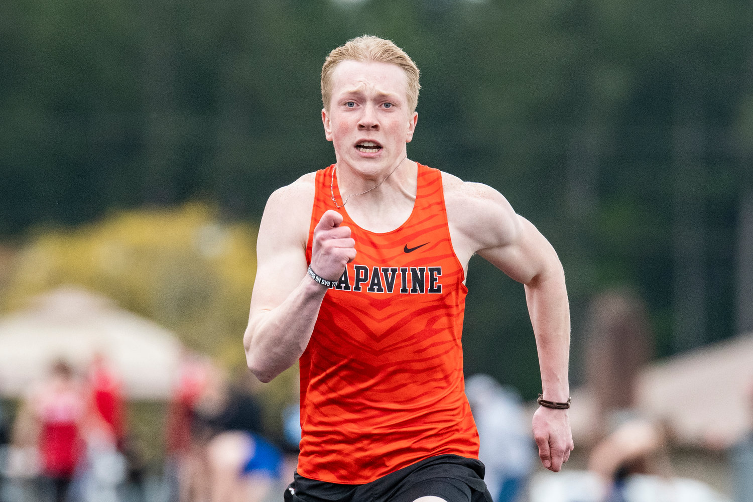 Napavine's Lucas Dahl sprints in the boys 100-meter dash at the Central 2B League Championships in Rainier on May 13.