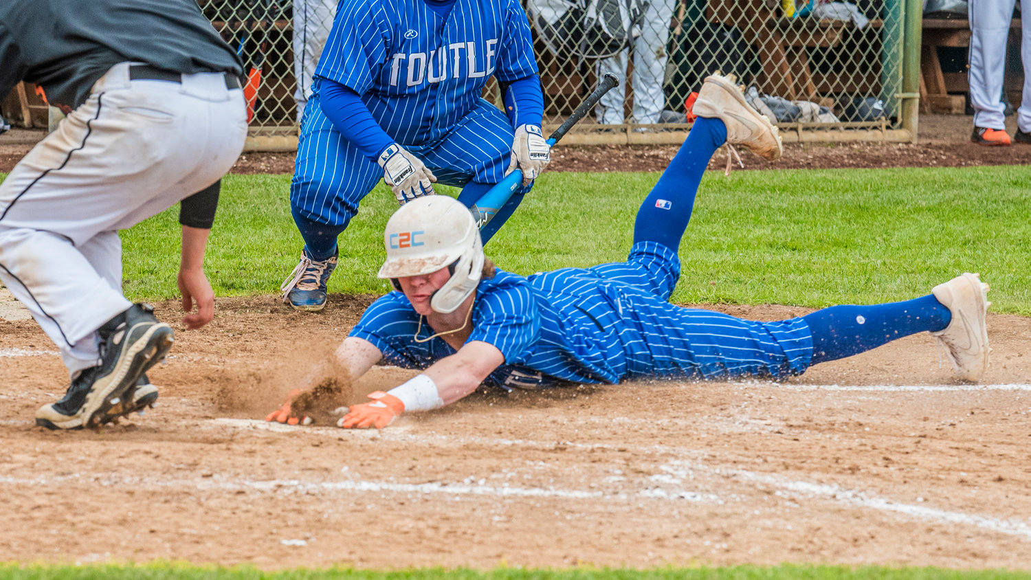 Toutle Lake’s Zach Swanson (10) slides in safe at home during a 2B District 4 Title game against the Napavine Tigers played Friday in Chehalis.