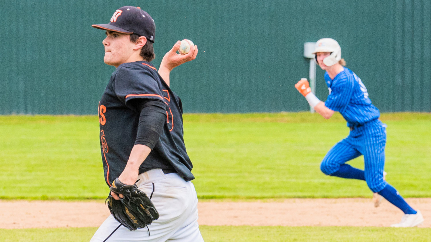 Napavine senior Gavin Parker (5) makes an out at home plate to prevent Toutle Lake from scoring during a 2B District 4 Title game Friday in Chehalis.