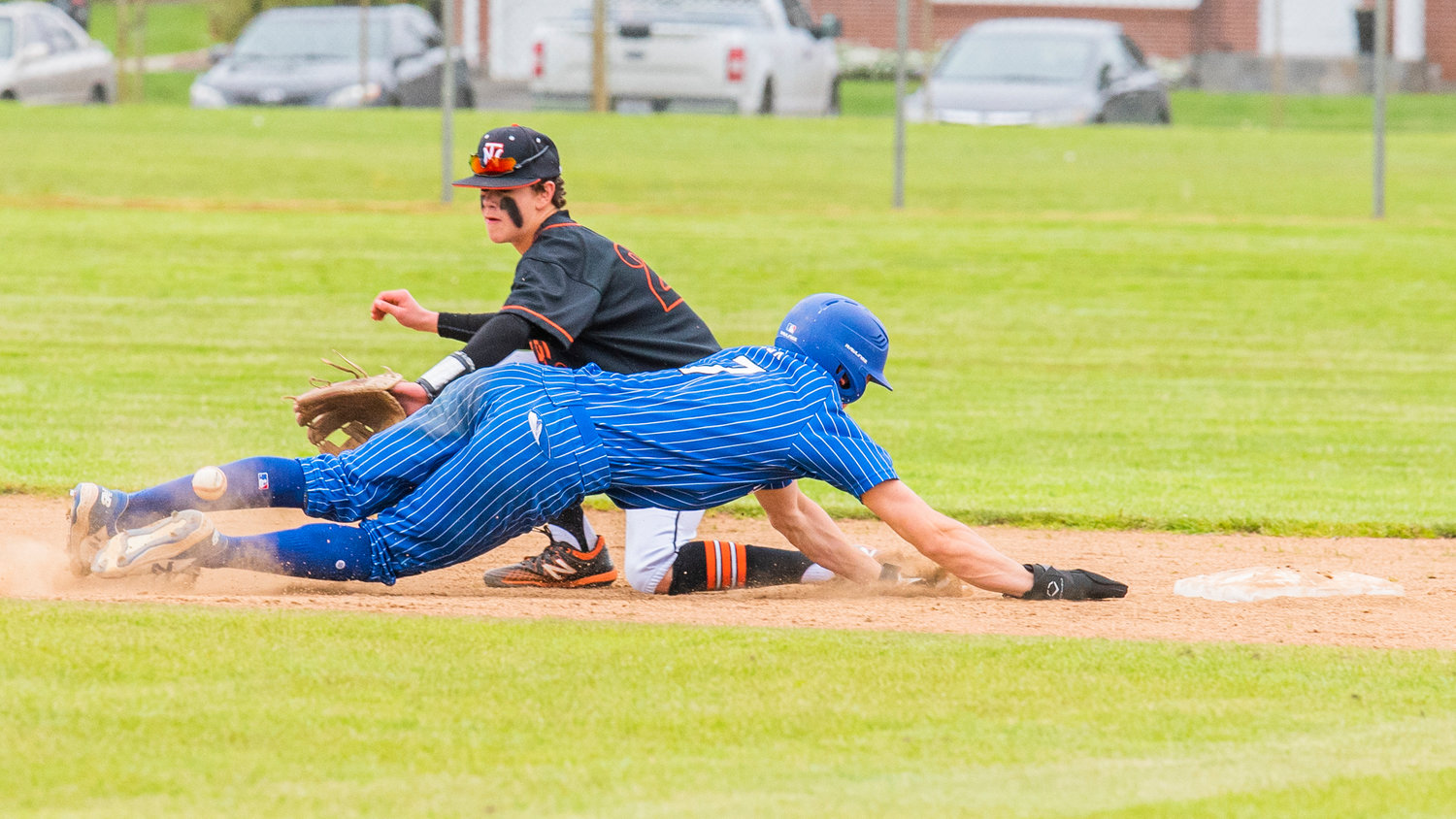 Napavine’s Connor Holmes (22) receives a throw down to second base as Toutle Lake senior Jackson Cox (7) slides back safe during a 2B District 4 Title game played Friday afternoon in Chehalis at W.F. West High School.
