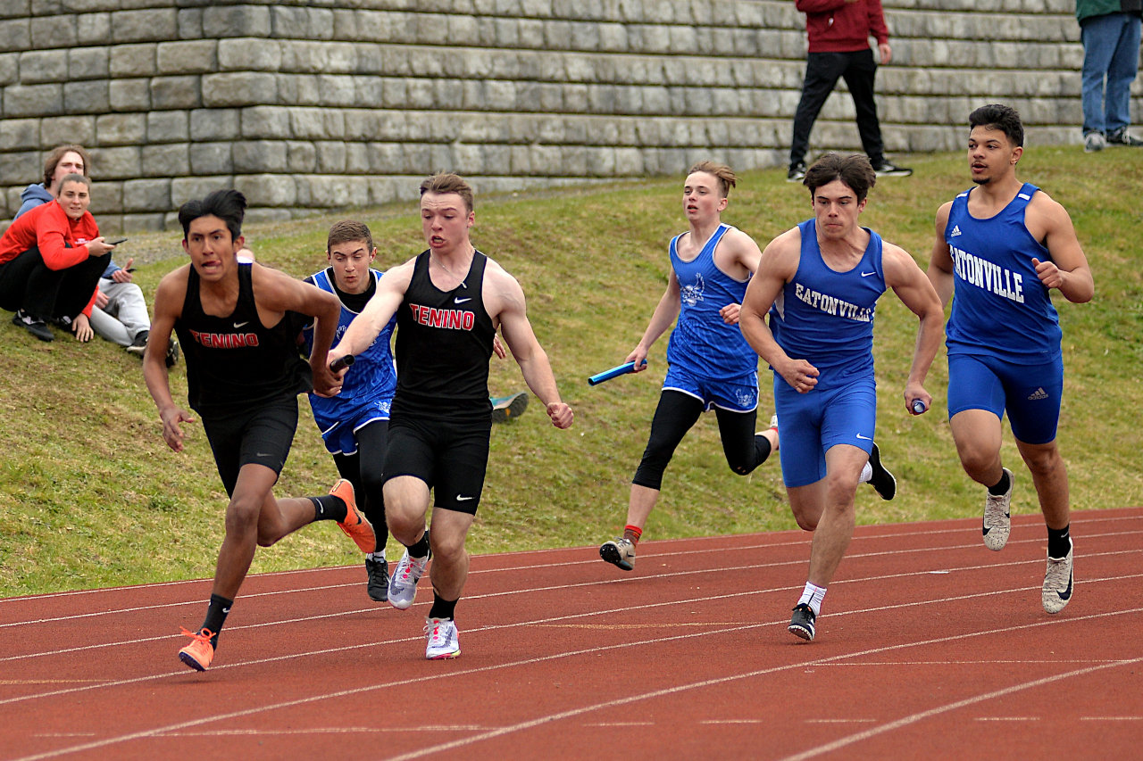 Tenino's Blaine Schott hands off to Salvador Ontiveros in the boys 4x100-meter relay at the 1A Evergreen League sub-districts on Friday in Montesano.