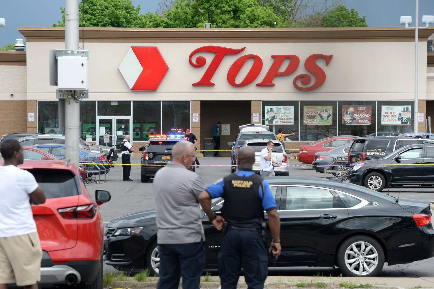 Police on scene at a Tops Friendly Market on Saturday, May 14, 2022, in Buffalo, New York. According to reports, at least 10 people were killed after a mass shooting at the store, with the shooter in police custody. (John Normile/Getty Images/TNS)