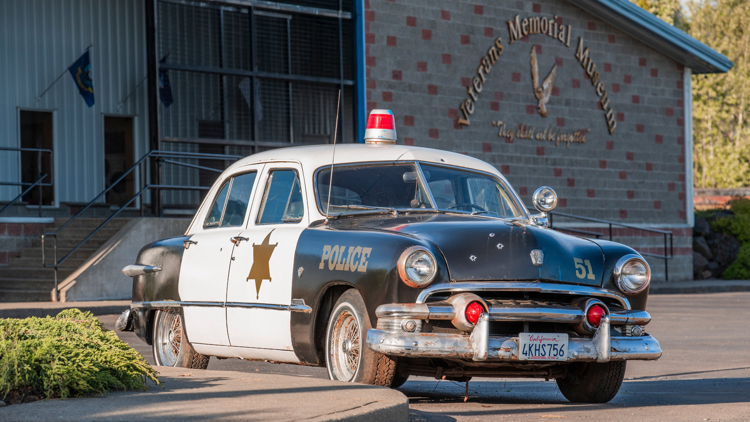A vintage police car is seen parked outside the Veterans Memorial Museum on Saturday.