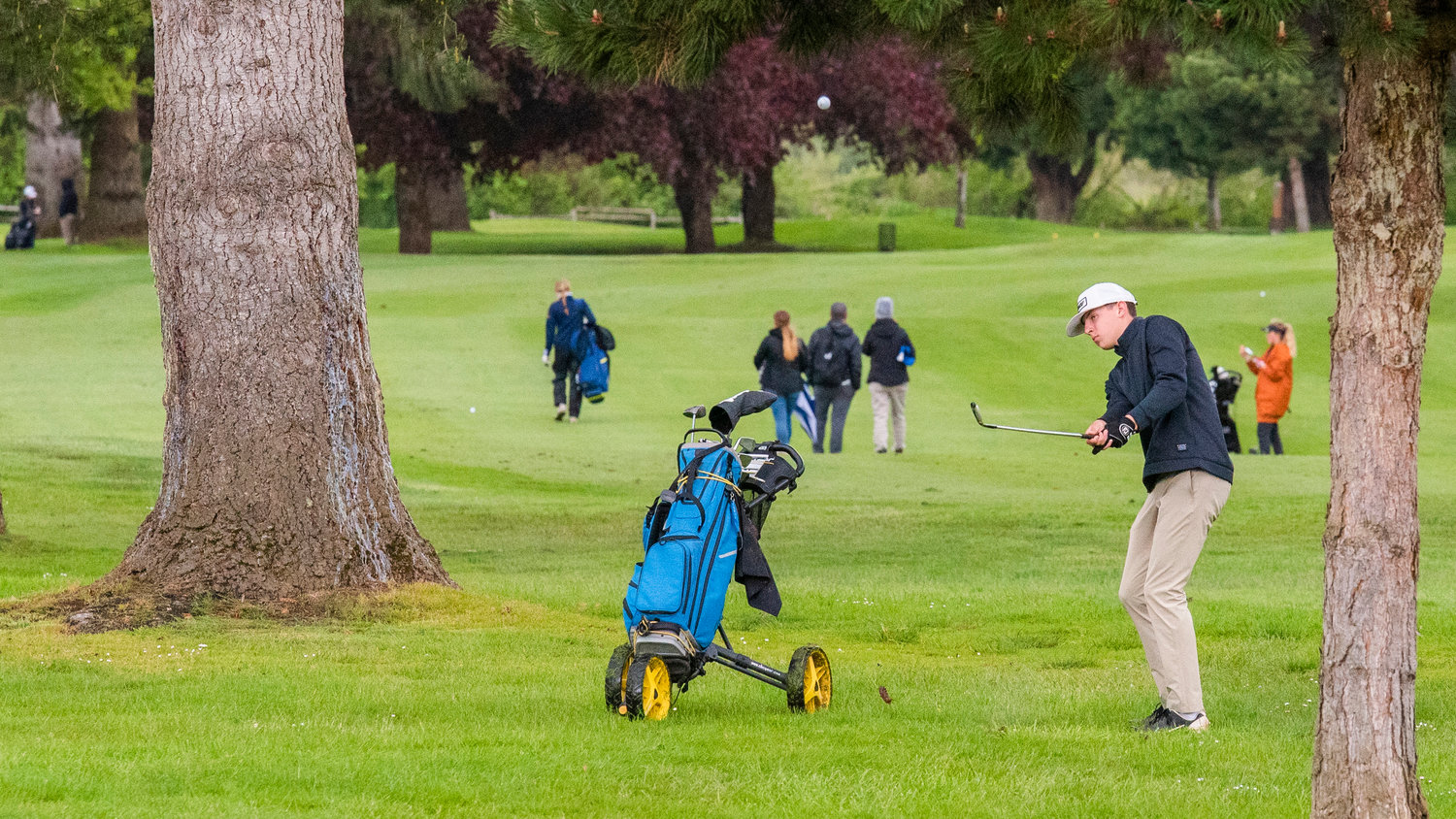 Adna’s Braeden Salme hits the ball into the air Wednesday afternooon, on day two of District 2B golf, at Riverside in Chehalis.