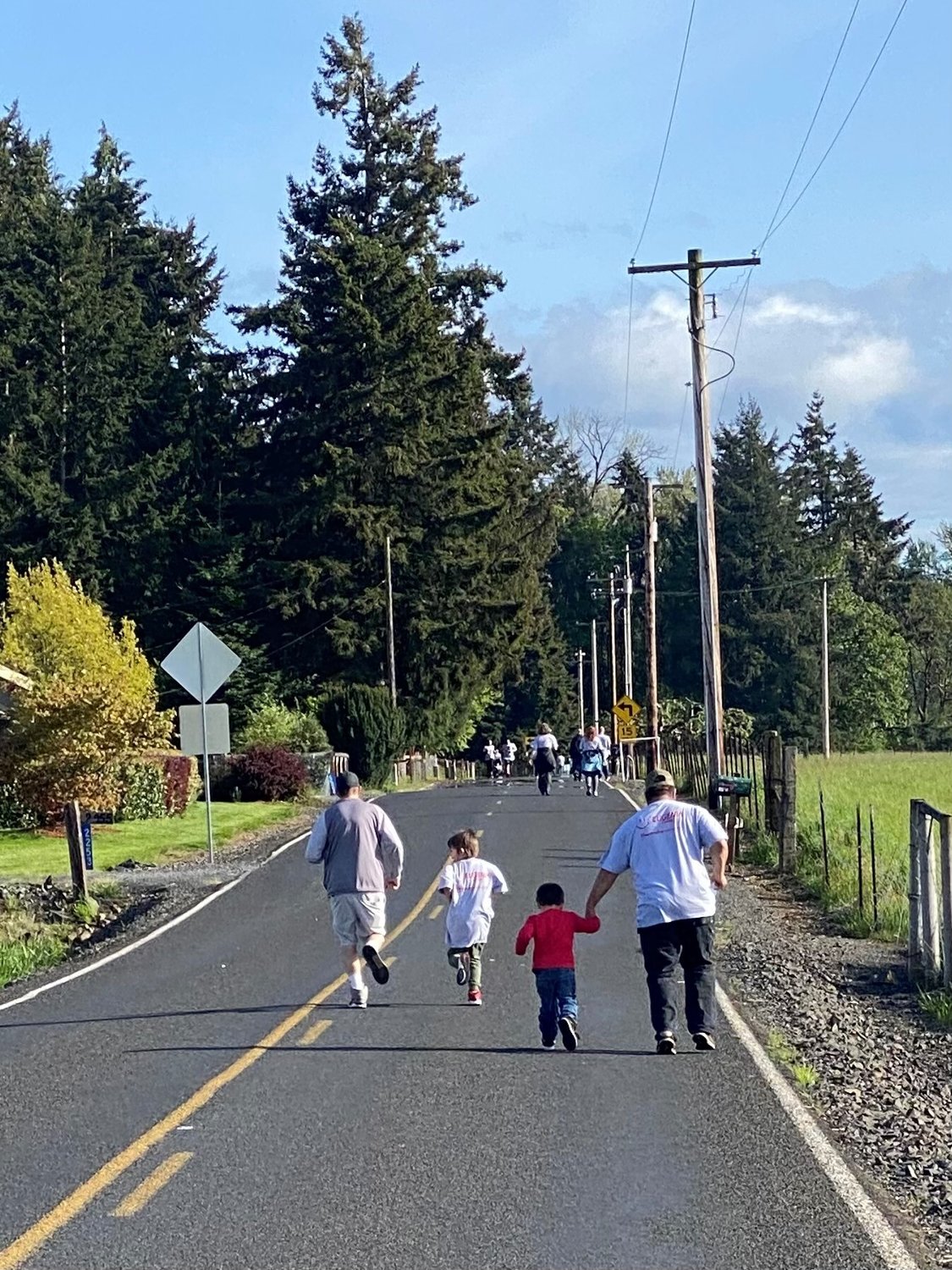 From left, Derek Shaughnessy runs with Axl Tatum, King Kastro and David Castro during the Run for Five, Recovery is Alive 5k in Chehalis on Monday.