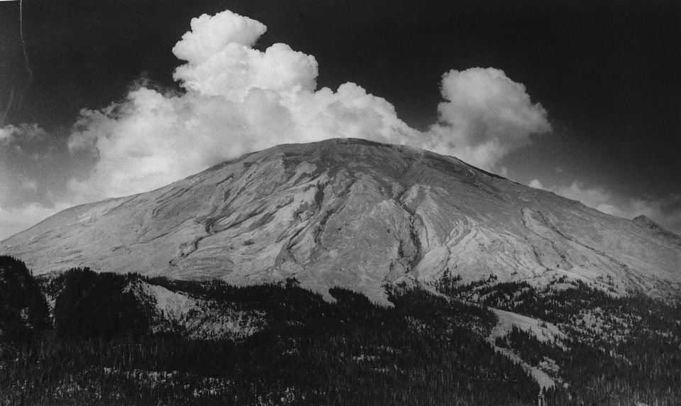 A gentle cloud of steam billows about 2,000 feet above the south face of Mount St. Helens shortly before the eruption. (The Oregonian)