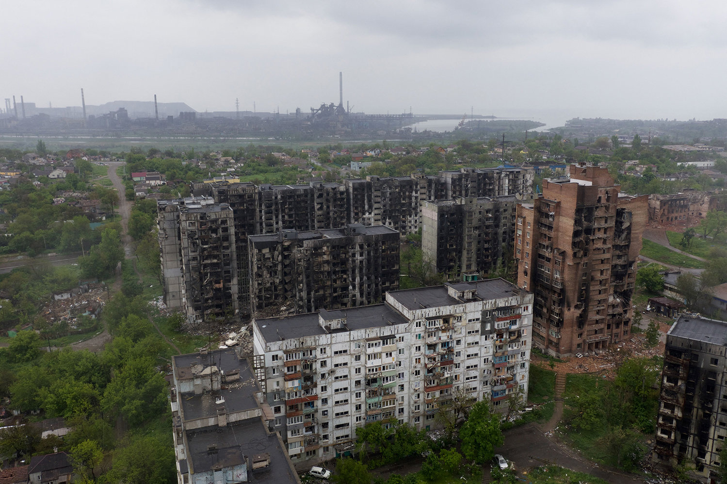 An aerial view of damaged residential buildings and the Azovstal steel plant in the background in the port city of Mariupol, Ukraine, on May 18, 2022, amid the ongoing Russian military action. (Andrey Borodulin/AFP via Getty Images/TNS)