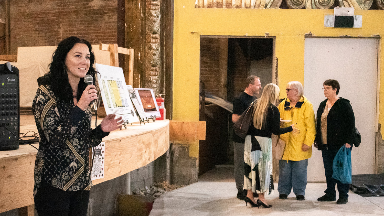 Naomi Snell introduces speakers and upcoming events during a Centralia-Chehalis Chamber of Commerce Business After Hours event and open house at the Fox Theater Thursday in Centralia.