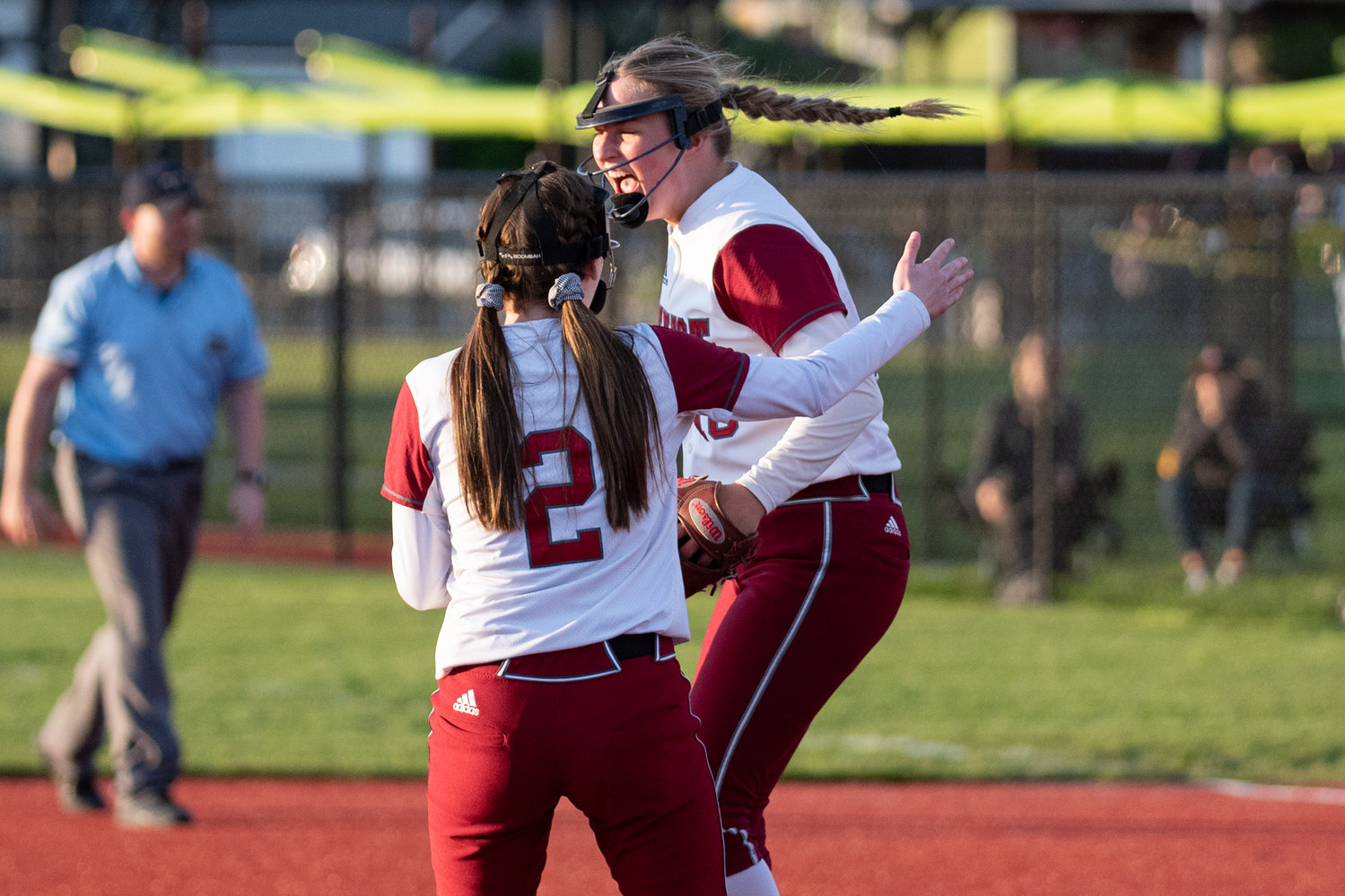 W.F. West pitcher Kamy Dacus and third baseman Saige Brindle (2) celebrate after defeating Tumwater, 4-2, in the district championship game at Rec Park May 20.